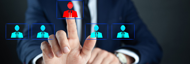 a person seen selecting candidates profile from a big screen